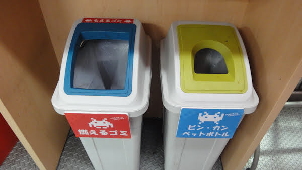 recycling bins with space invaders on them